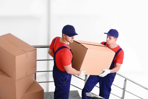 Professional team moving desks and IT equipment for an office move in Ruislip