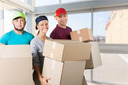 Office relocation preparation with labelled boxes and furniture in Ruislip