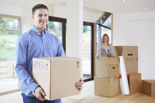 Loading furniture and boxes into a moving truck in Ruislip