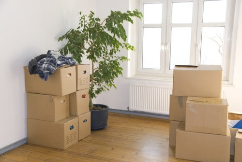 Packed moving boxes and furniture ready for a house move in Ruislip