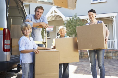 Packed office items and moving boxes ready for transport in Ruislip