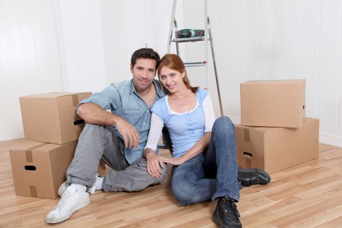 Organised moving boxes and packing materials ready for collection