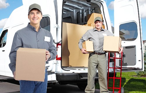 Loading boxes and home items into a removals van in Ruislip